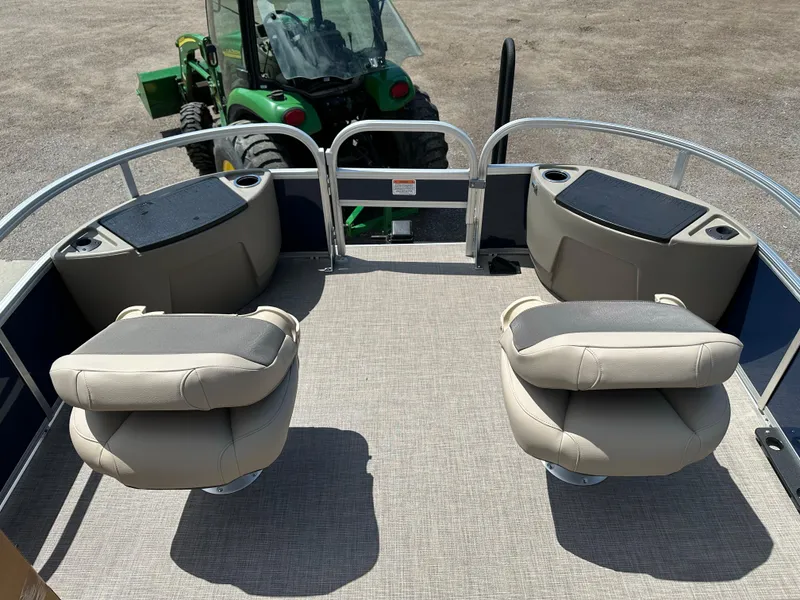 Slide: The Image of 2025 Sun Tracker Bass Buggy 18 DLX pontoon boat interior with seating and storage. - 9