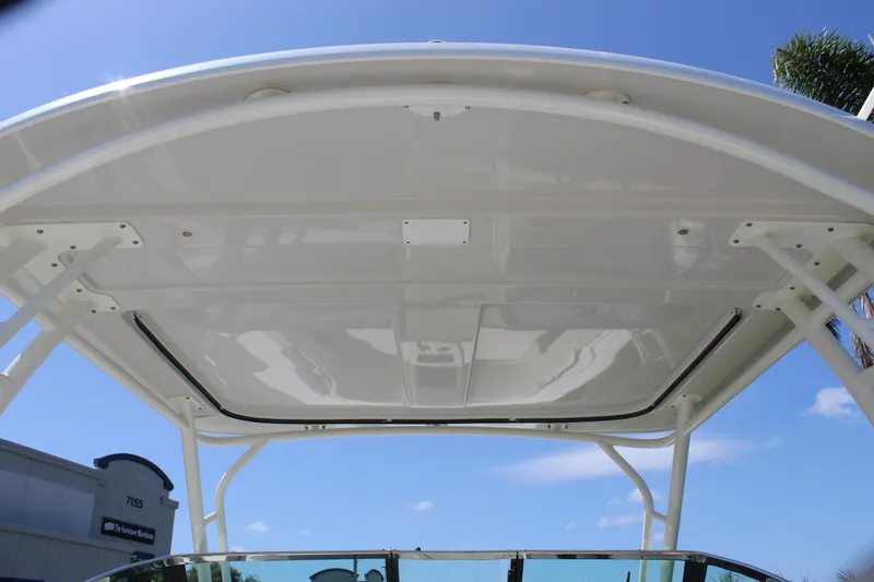 Slide: The Image of 2018 Boston Whaler 270 Vantage boat canopy under clear blue sky. - 25