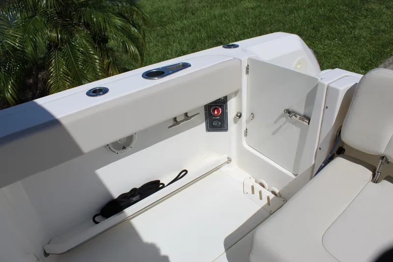 Slide: The Image of 2018 Boston Whaler 270 Vantage boat interior with open storage compartment and seating. - 29