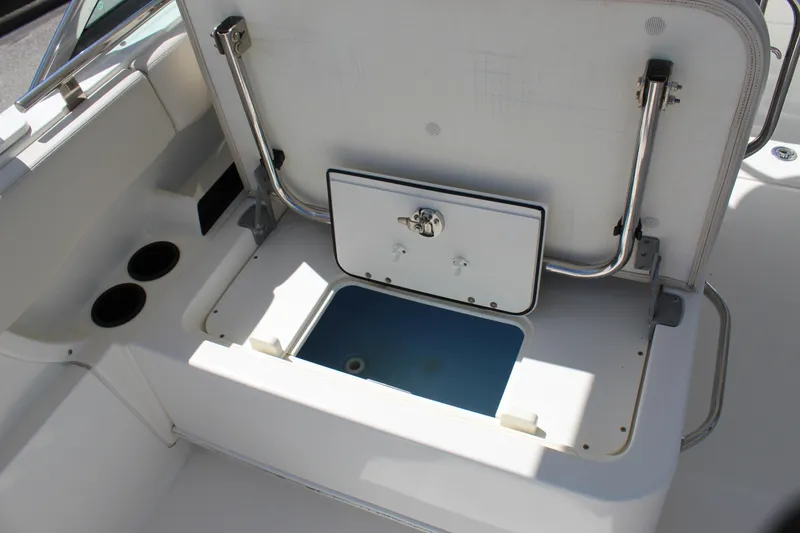 Slide: The Image of Open storage compartment on a 2018 Boston Whaler 270 Vantage boat. - 32