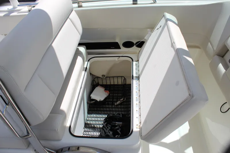 Slide: The Image of 2018 Boston Whaler 270 Vantage boat seat with open storage compartment. - 34
