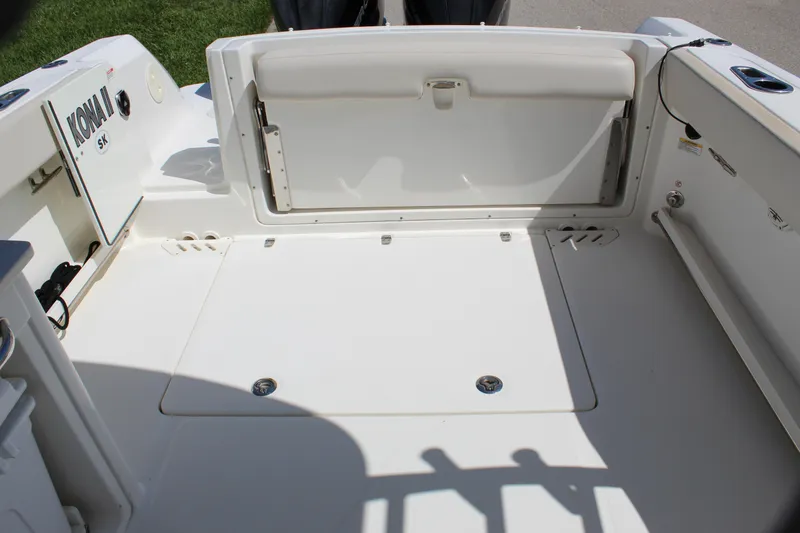 Slide: The Image of 2018 Boston Whaler 270 Vantage boat interior, featuring spacious deck and storage area. - 38