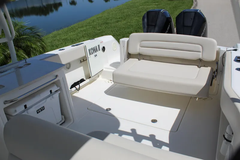 Slide: The Image of 2018 Boston Whaler 270 Vantage boat interior with seating and twin Mercury engines. - 40
