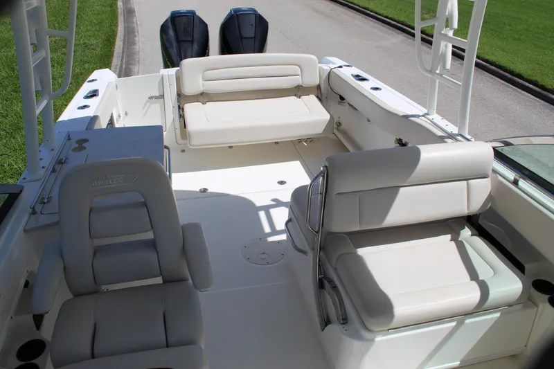 Slide: The Image of 2018 Boston Whaler 270 Vantage boat interior with seating and dual engines. - 41