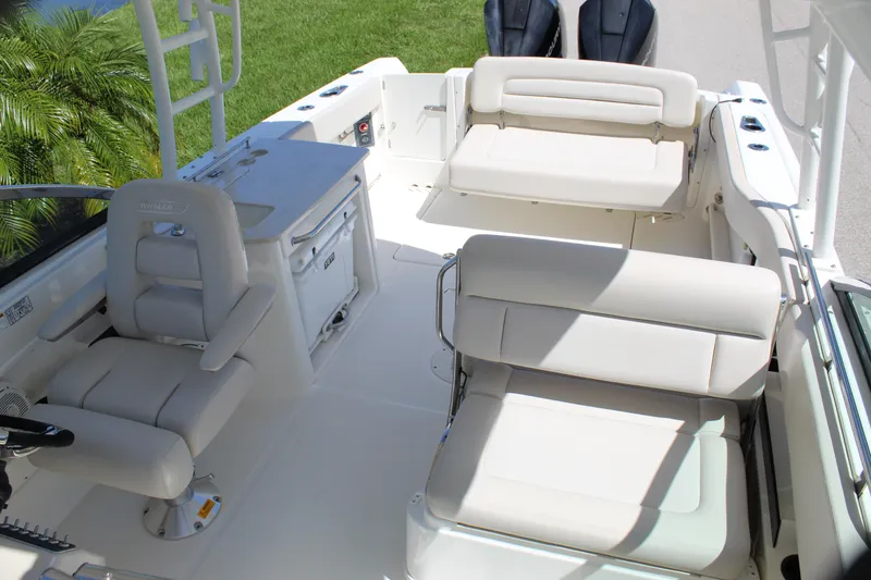 Slide: The Image of 2018 Boston Whaler 270 Vantage boat interior with seating and helm station. - 42