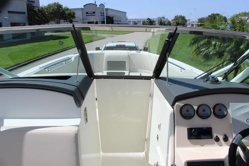 Slide: The Image of 2018 Boston Whaler 270 Vantage boat interior with dashboard and seating area. - 43