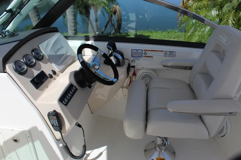 Slide: The Image of 2018 Boston Whaler 270 Vantage helm with Garmin system and comfortable seating. - 46