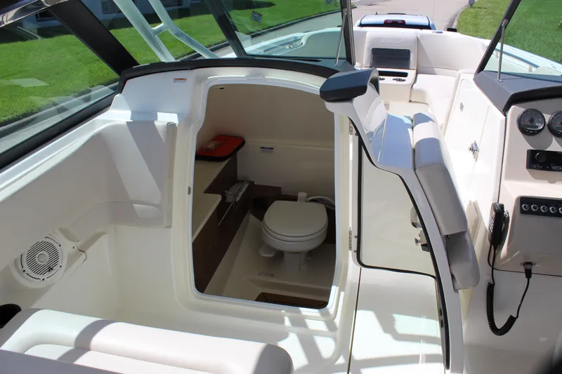 Slide: The Image of 2018 Boston Whaler 270 Vantage boat interior with open cabin and visible toilet. - 48
