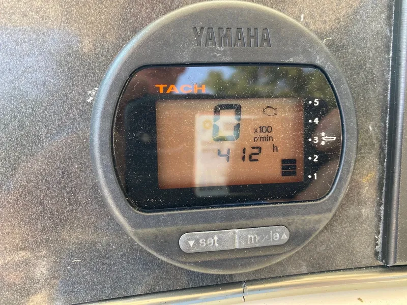 Slide: The Image of Yamaha tachometer display showing 412 hours on a 2012 Scout 225 XSF boat. - 4