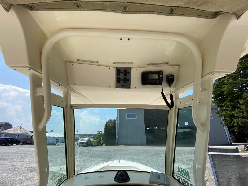 Slide: The Image of Interior view of 2012 Scout 225 XSF boat console with radio and controls. - 6