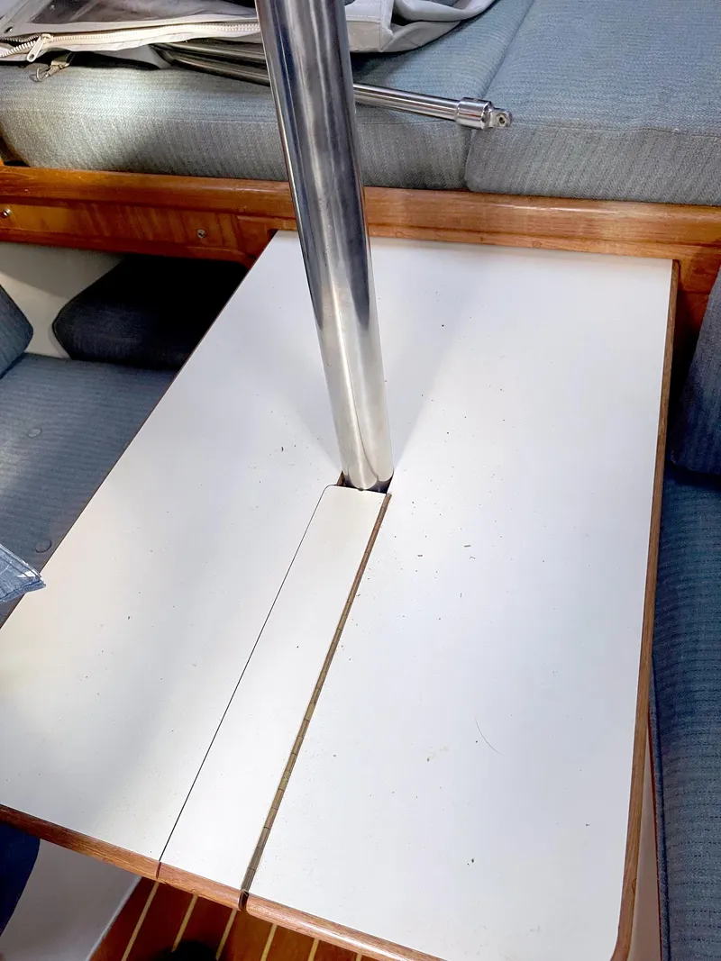 Slide: The Image of Interior of 1987 Pacific Seacraft Dana 24 sailboat with table and metal pole. - 7