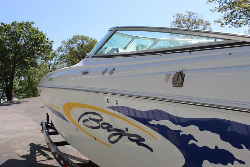 Slide: The Image of 2002 Baja 342 boat on trailer, featuring sleek design and vibrant graphics. - 16