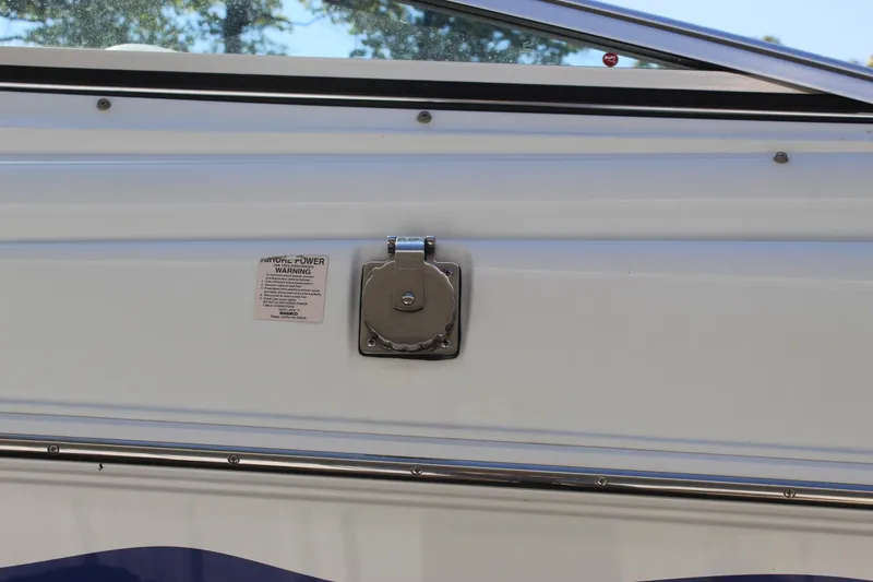 Slide: The Image of 2002 Baja 342 boat detail showing a metal fixture and label on the side. - 17