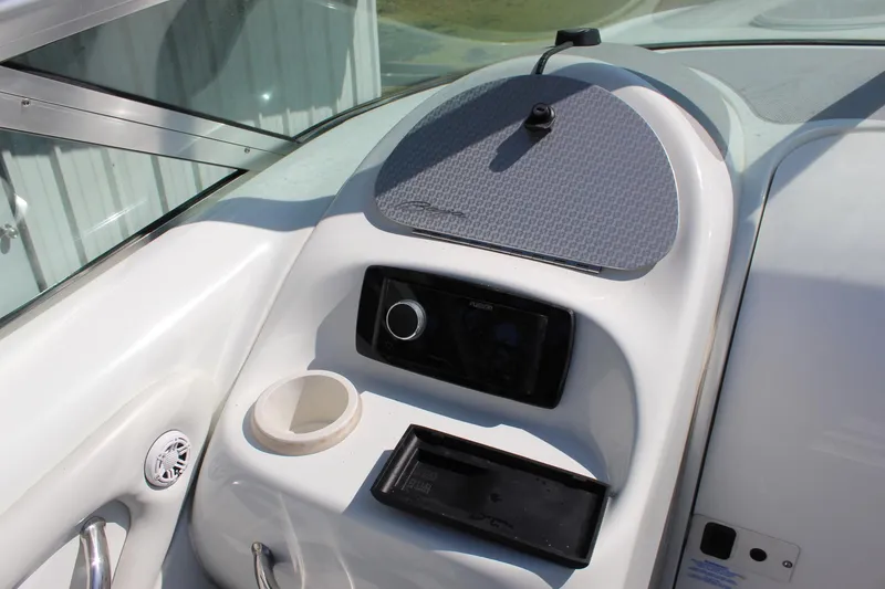 Slide: The Image of 2002 Baja 342 boat dashboard with cup holder and control panel. - 22