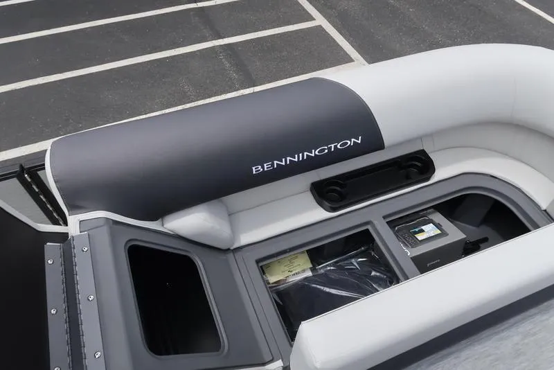 Slide: The Image of Bennington S Quad Bench 22 SSR 2026 boat interior with storage compartments. - 14