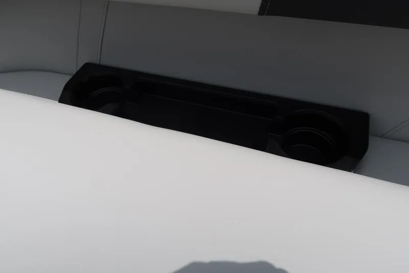 Slide: The Image of Bennington S Quad Bench 22 SSR 2026, white seating with integrated black cup holders. - 15