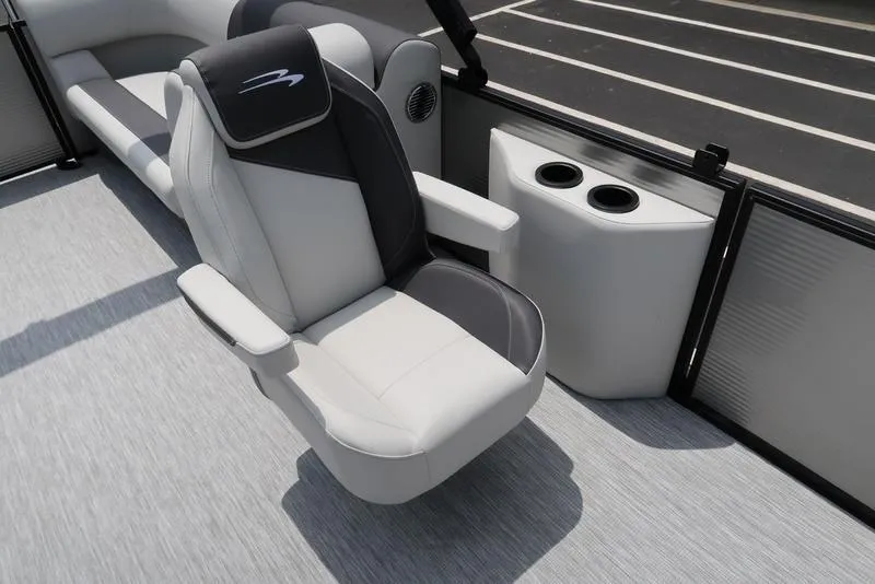 Slide: The Image of 2026 Bennington S Quad Bench 22 SSR boat interior with plush seating and cup holders. - 19
