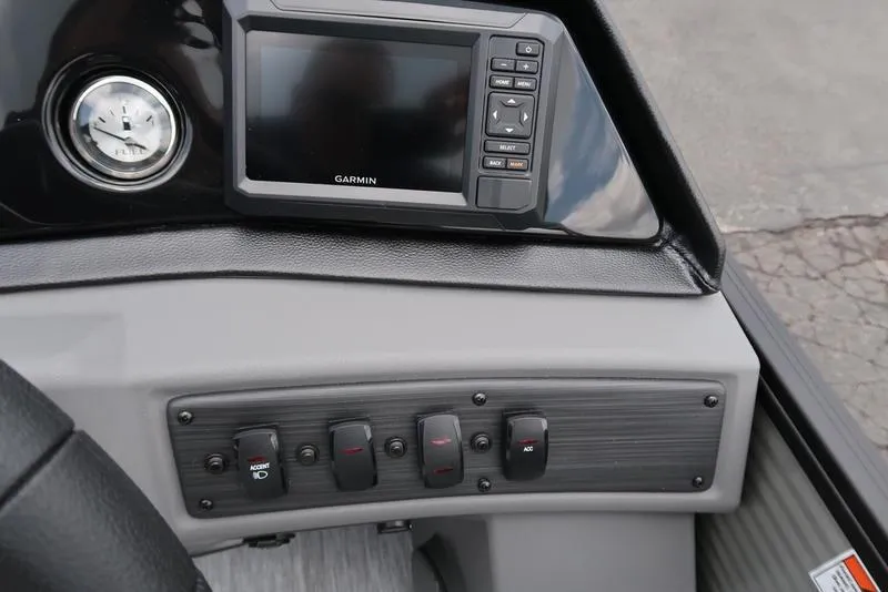 Slide: The Image of Control panel of 2026 Bennington S Quad Bench 22 SSR with Garmin display and switches. - 21