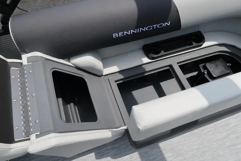 Slide: The Image of 2026 Bennington S Quad Bench 22 SSR with open storage compartments and cup holders. - 26