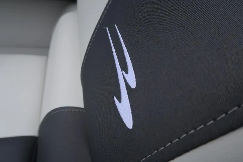 Slide: The Image of Close-up of 2026 Bennington S Quad Bench 22 SSR seat with logo detail. - 6