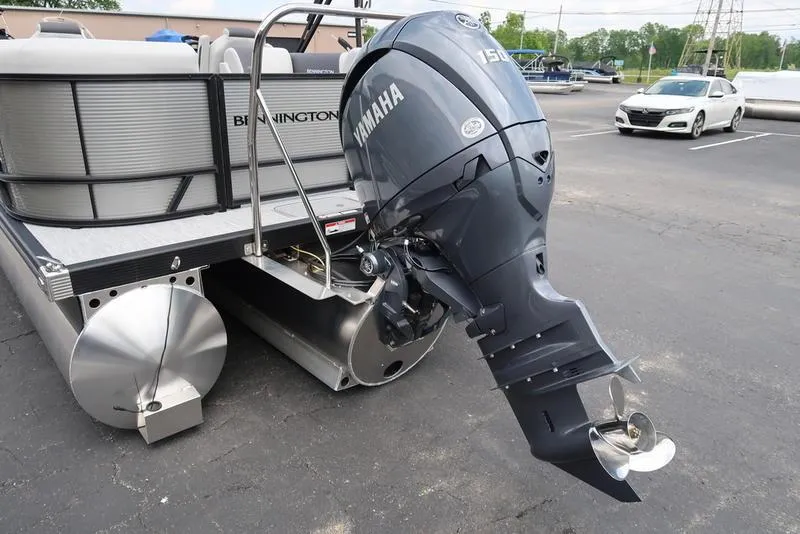 Slide: The Image of 2026 Bennington S Quad Bench 22 SSR pontoon boat with Yamaha outboard motor. - 7