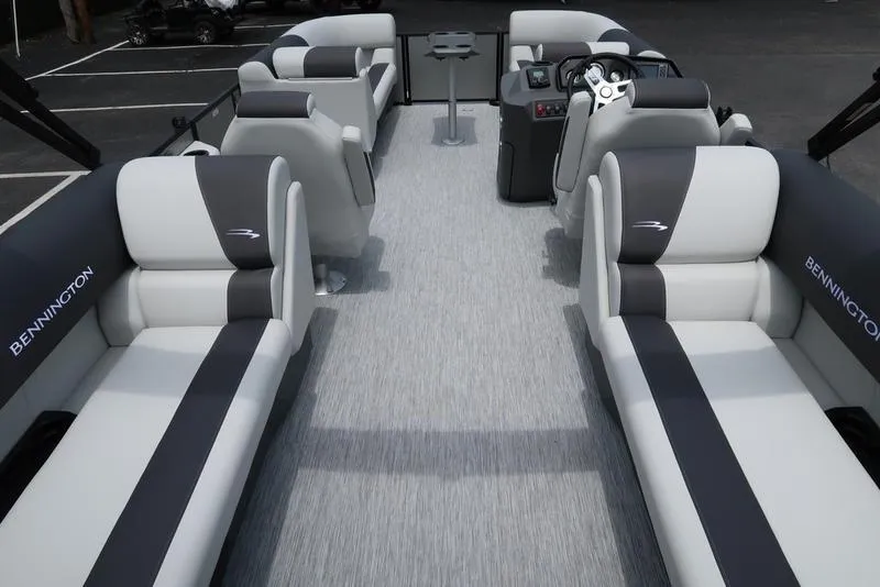 Slide: The Image of 2026 Bennington S Quad Bench 22 SSR pontoon boat interior with stylish seating and helm. - 8