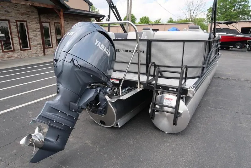 Slide: The Image of 2026 Bennington S Quad Bench 22 SSR pontoon boat with Yamaha outboard motor. - 9