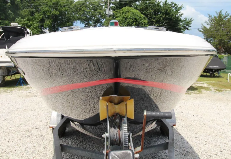 Slide: The Image of 2009 Regal 2200 Bowrider boat on trailer, front view, outdoors. - 7