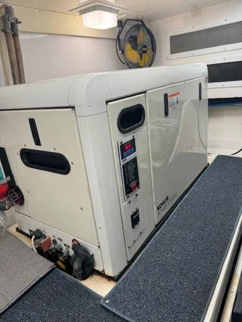 Slide: The Image of Kohler generator in a 1988 Bertram 54 Convertible yacht engine room. - 26