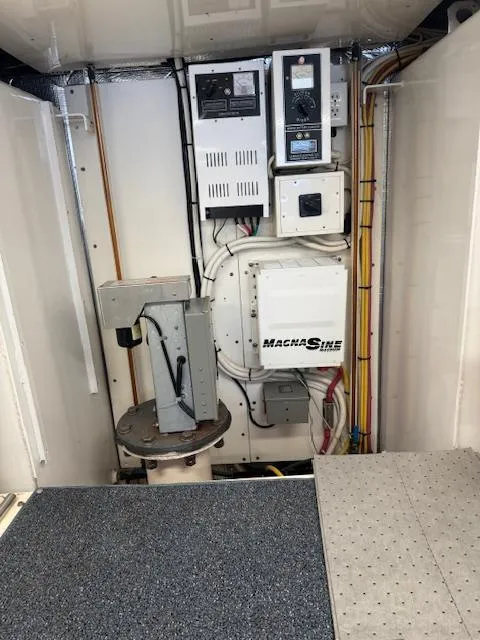 Slide: The Image of Electrical panel and equipment inside a 1988 Bertram 54 Convertible boat. - 27