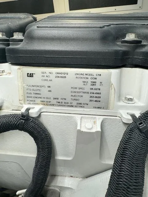 Slide: The Image of Engine label on a 1988 Bertram 54 Convertible, featuring CAT C18 specifications. - 29