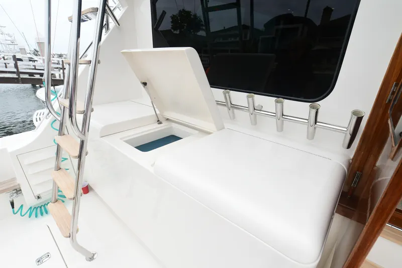 Slide: The Image of 1988 Bertram 54 Convertible yacht interior with ladder and storage compartment. - 7