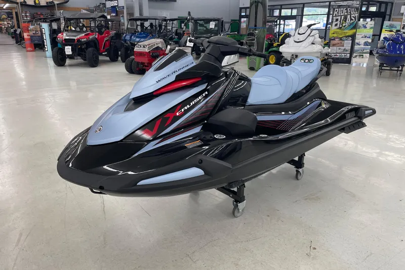 Slide: The Image of 2025 Yamaha WaveRunner VX Cruise in showroom, sleek design, black and blue color scheme. - 3