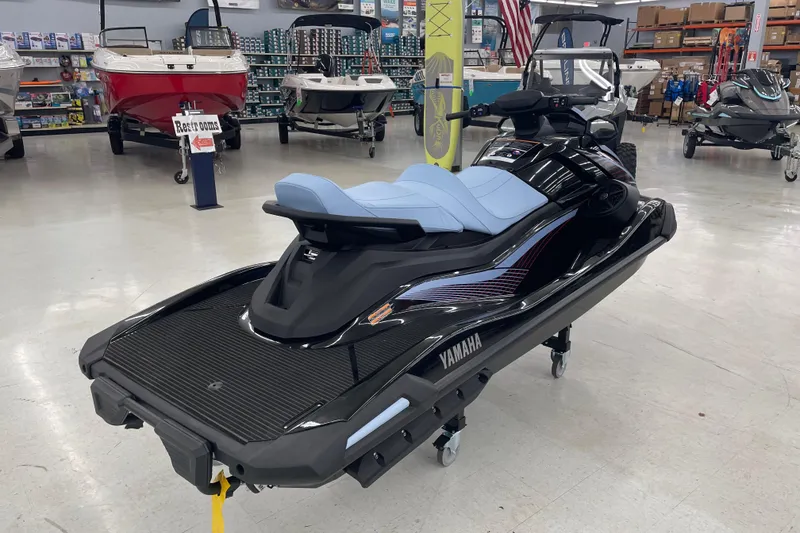 Slide: The Image of 2025 Yamaha WaveRunner VX Cruise in showroom, featuring sleek design and blue seating. - 6