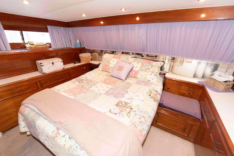 Slide: The Image of Luxurious bedroom in 1985 Ocean Yachts 46 Sunliner with cozy decor and ample storage. - 17