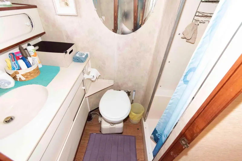 Slide: The Image of Bathroom interior of 1985 Ocean Yachts 46 Sunliner with shower and vanity. - 18