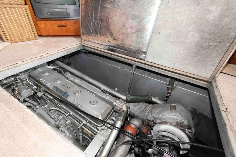 Slide: The Image of Engine compartment of 1985 Ocean Yachts 46 Sunliner, featuring a Detroit Diesel engine. - 21