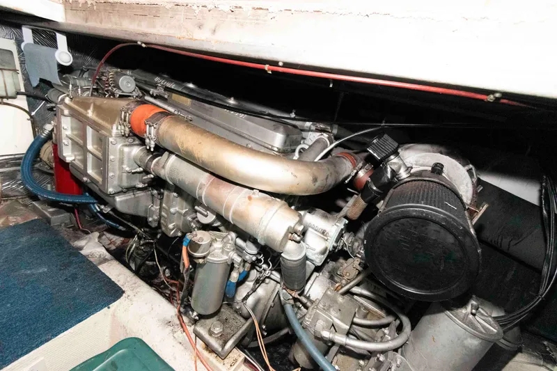 Slide: The Image of Engine compartment of 1985 Ocean Yachts 46 Sunliner, showcasing mechanical components. - 23
