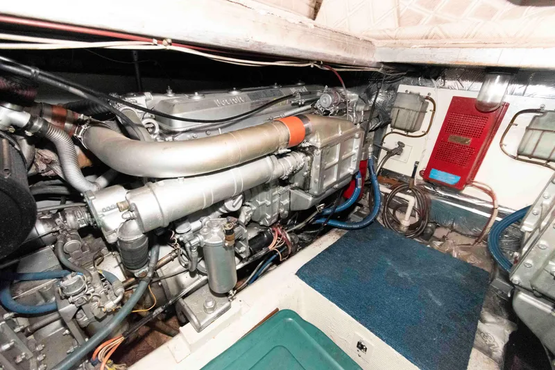 Slide: The Image of Engine room of 1985 Ocean Yachts 46 Sunliner, showcasing mechanical components and systems. - 24