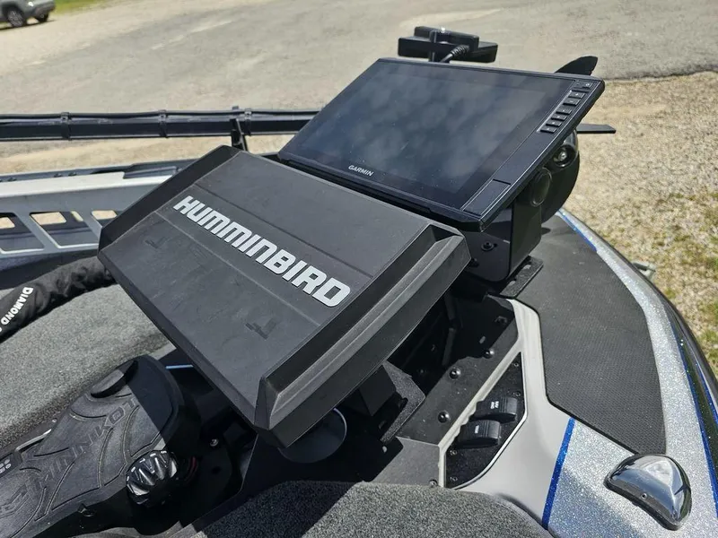 Slide: The Image of 2025 Skeeter FXR21 PRO boat with Humminbird electronics and Garmin display on deck. - 16