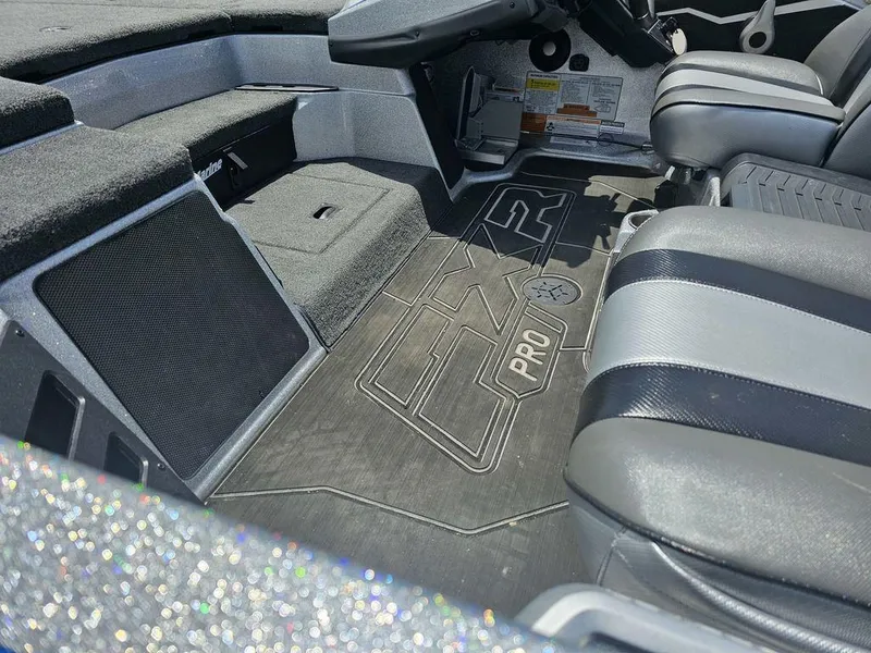 Slide: The Image of Interior of 2025 Skeeter FXR21 PRO boat with sleek seating and detailed flooring. - 4