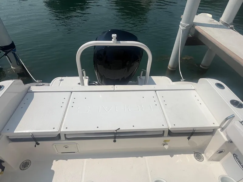 Slide: The Image of 2020 Robalo R230 Center Console boat stern view at dock. - 11