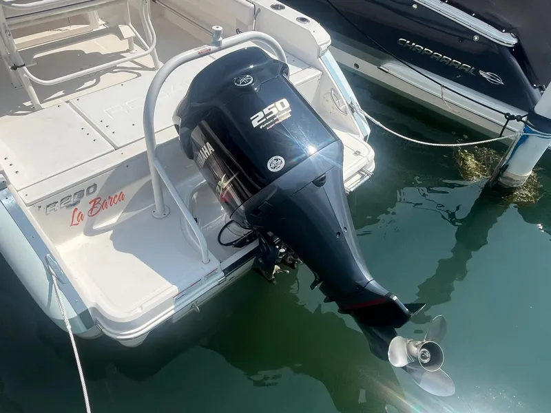 Slide: The Image of 2020 Robalo R230 Center Console with Yamaha 250 outboard motor, docked in marina. - 12