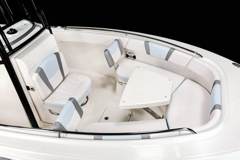 Slide: The Image of Manufacturer Provided Image: 2020 Robalo R230 Center Console boat seating area with table and cushioned seats. - 21