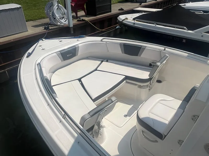 Slide: The Image of 2020 Robalo R230 Center Console boat with spacious seating and sleek design. - 3