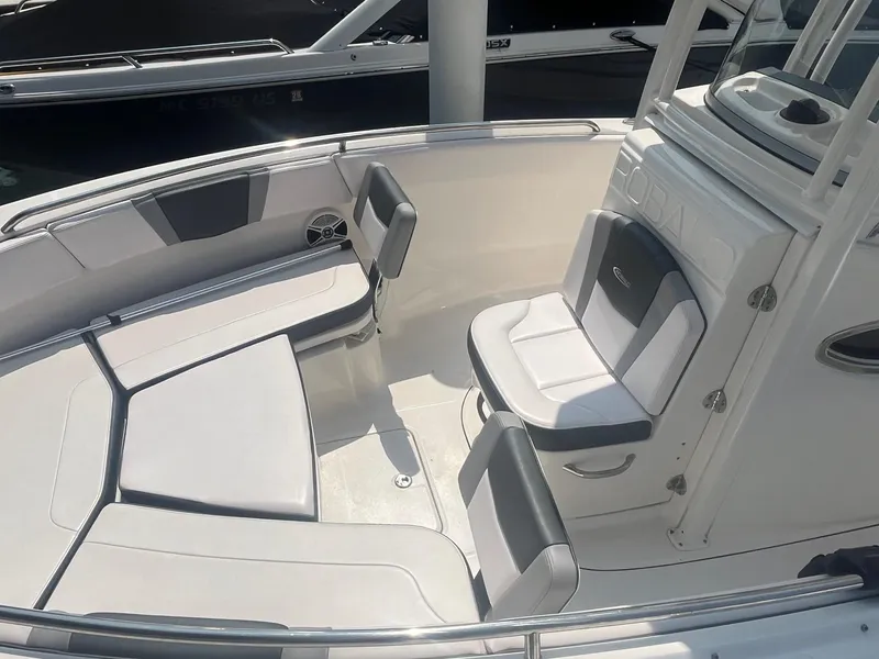 Slide: The Image of 2020 Robalo R230 Center Console boat interior with cushioned seating and sleek design. - 4