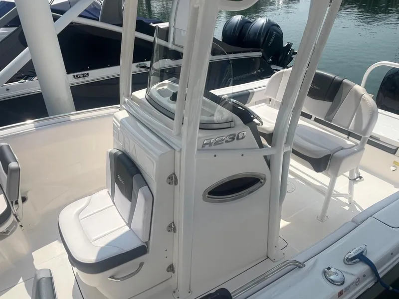 Slide: The Image of 2020 Robalo R230 Center Console boat interior with seating and console details. - 5