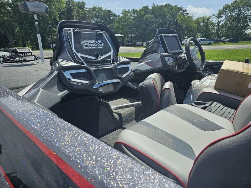 Slide: The Image of 2017 Skeeter FX21 LE boat interior with modern dashboard and seating. - 11