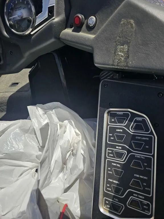 Slide: The Image of 2017 Skeeter FX21 LE boat dashboard with control panel and switches. - 8