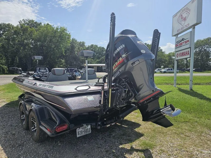 Slide: The Image of 2017 Skeeter FX21 LE boat with Yamaha engine, parked outdoors near dealership sign. - 9